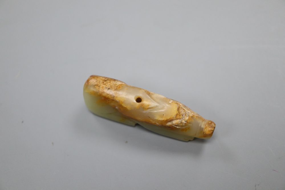 A Chinese celadon and russet jade figure of a pig, Han dynasty or later